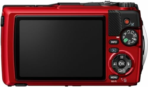 Back view of a red digital camera with screen and control buttons